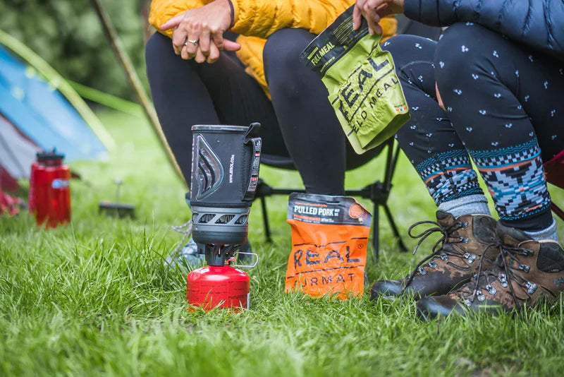 Campers eating freeze dried meals