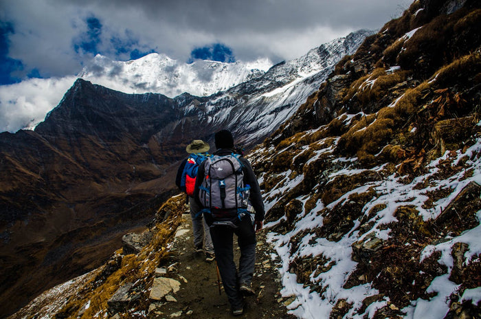 Men treking on mountain