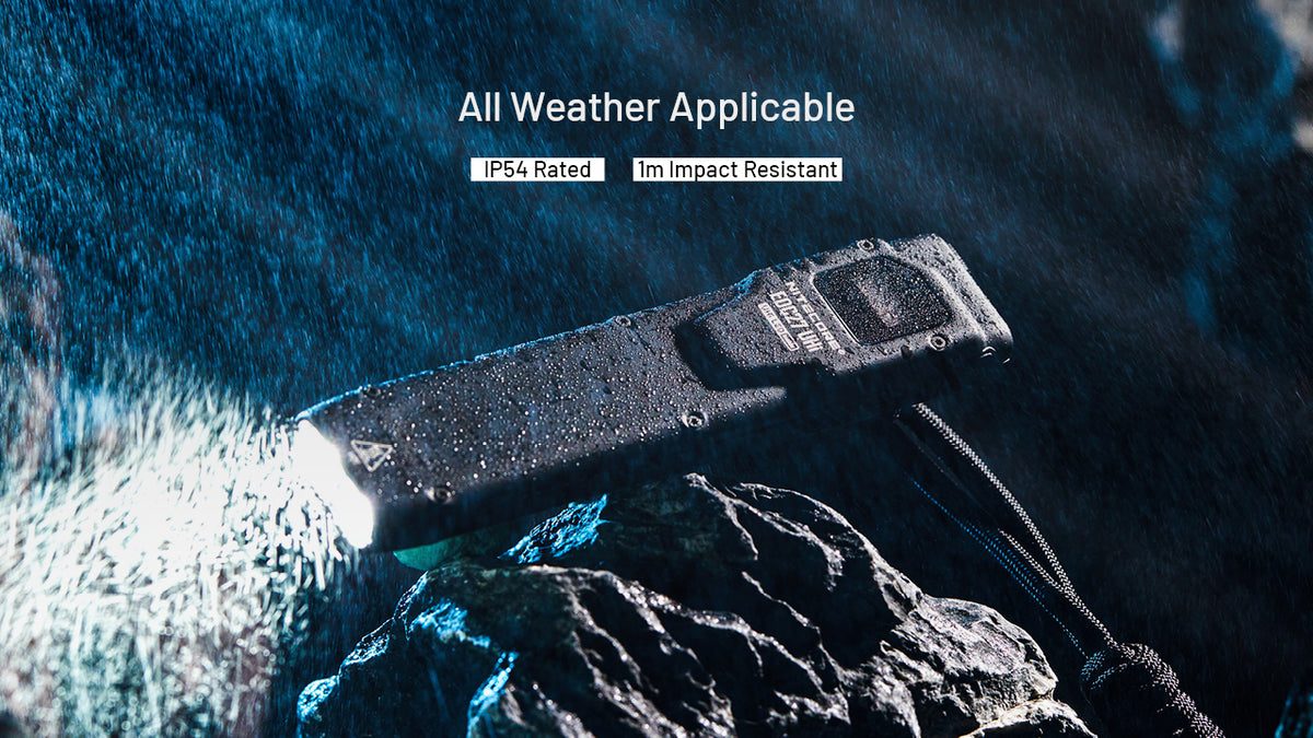 Nitecore EDC27 UHI flashlight on wet rocks showing weather resistance
