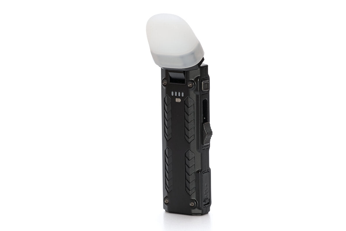 Nitecore EDC09 flashlight upright with white diffuser fitted