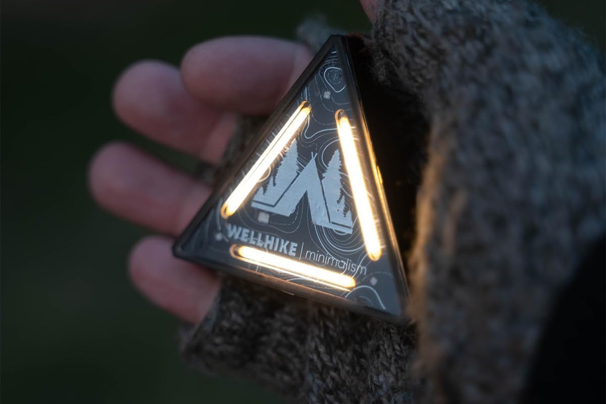 Wellhike Safey Beacon illuminated in hand