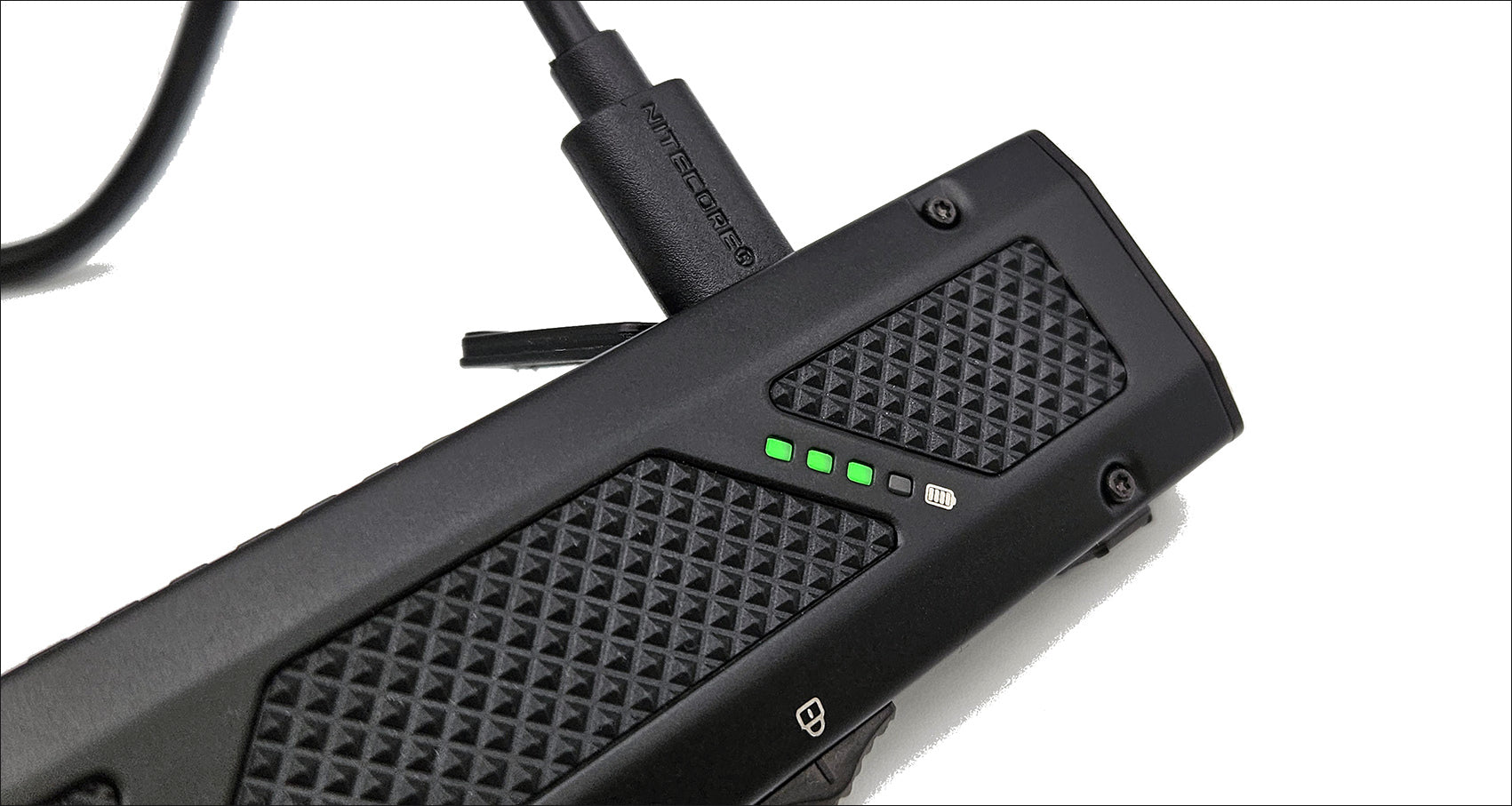 Black electronic device with textured surface and visible branding on a white background