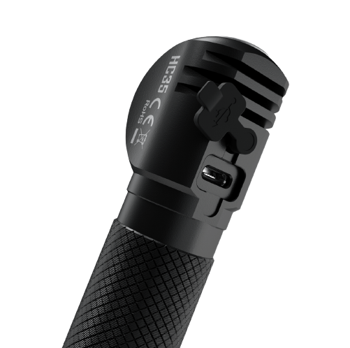 Nitecore HC35 charging port beneath rubber cover, close-up
